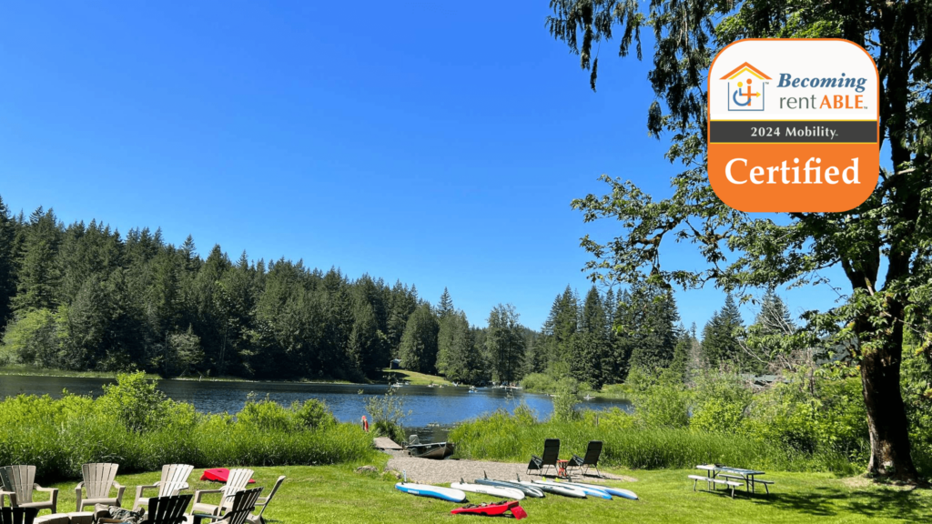 private dock on lake with kayaks and seating on a sunny day