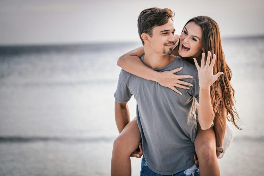 couples proposal at the beach