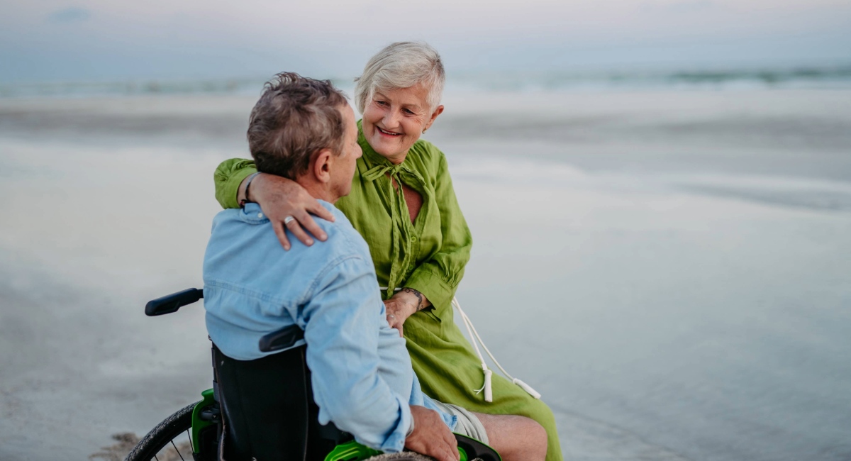 Senior couple enjoying accessible beach walk in Gearhart Oregon, wheelchair-friendly shoreline and relaxed coastal travel experience