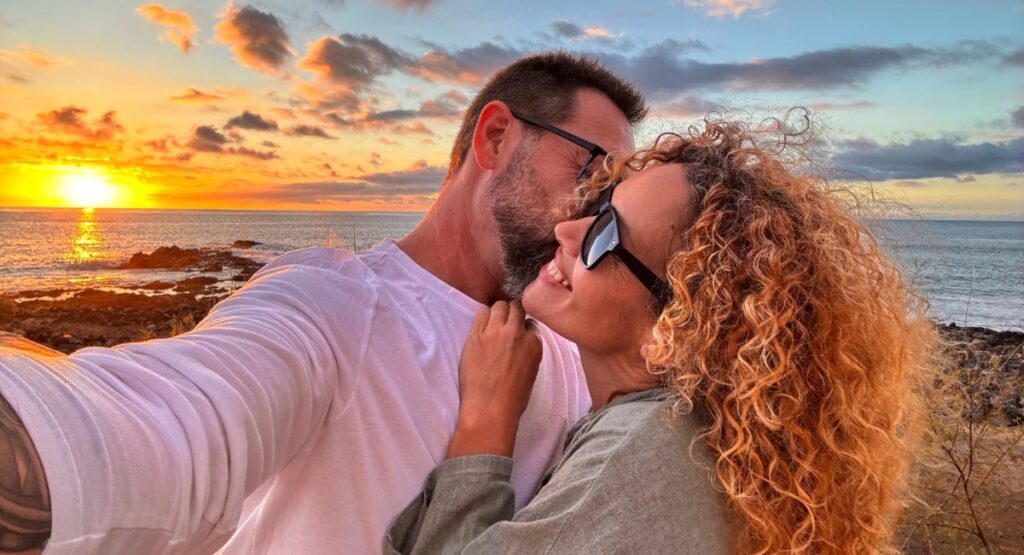 Couple embracing at sunset along the Oregon Coast near Gearhart Beach