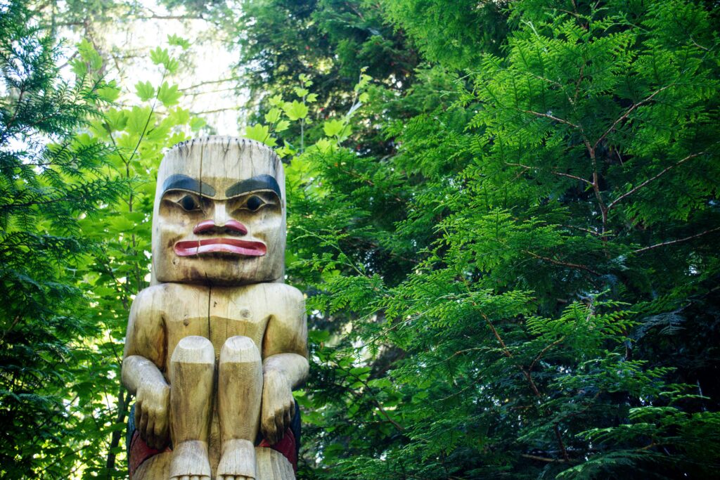 First Nations totem pole in the forest of BC