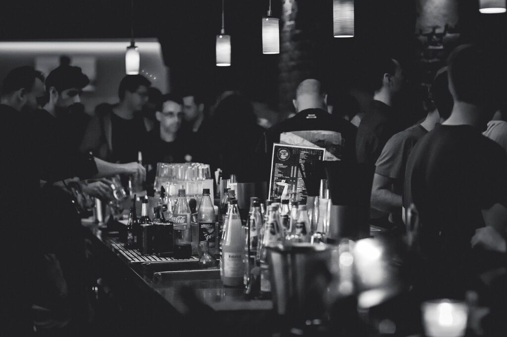 black and white photo of bar, people, bottles-463476.jpg