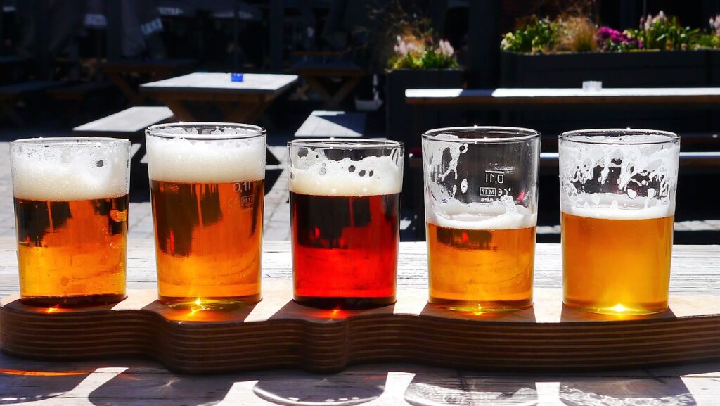 flight of beer on a patio table in the sun flight