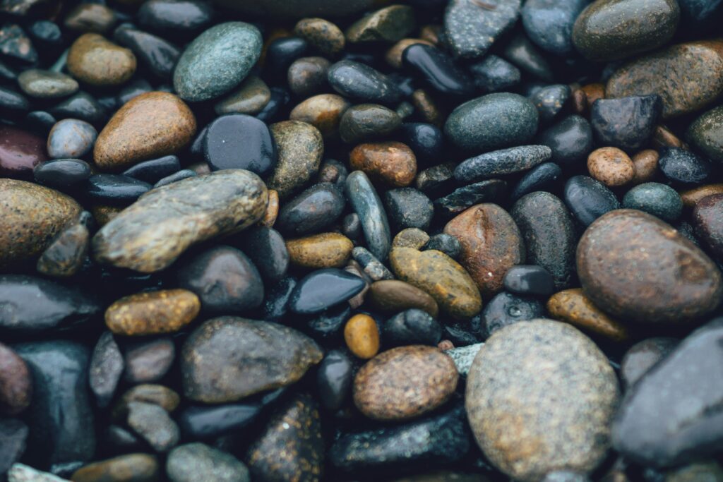 wet rocks on a pebbly beach