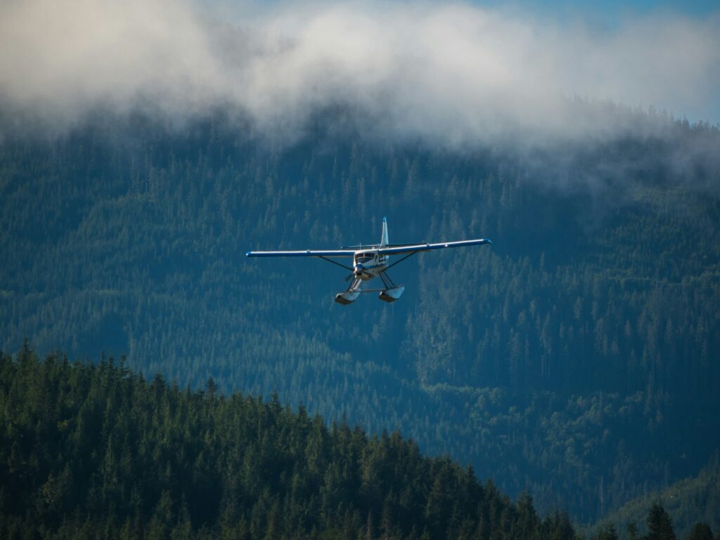 seaplane over evergreen forests on Vancouver Island